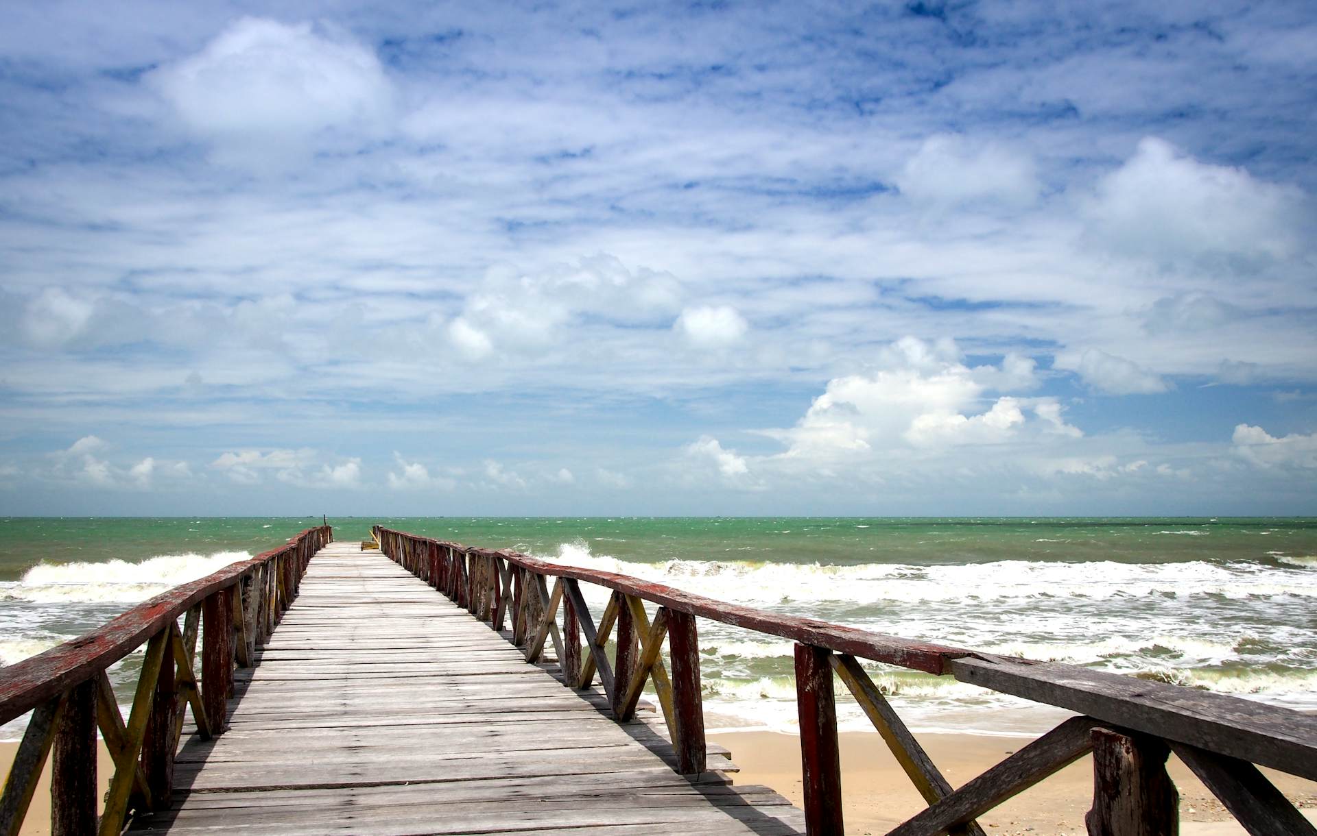 Jetty running into the sea on the beach at Ream National Park